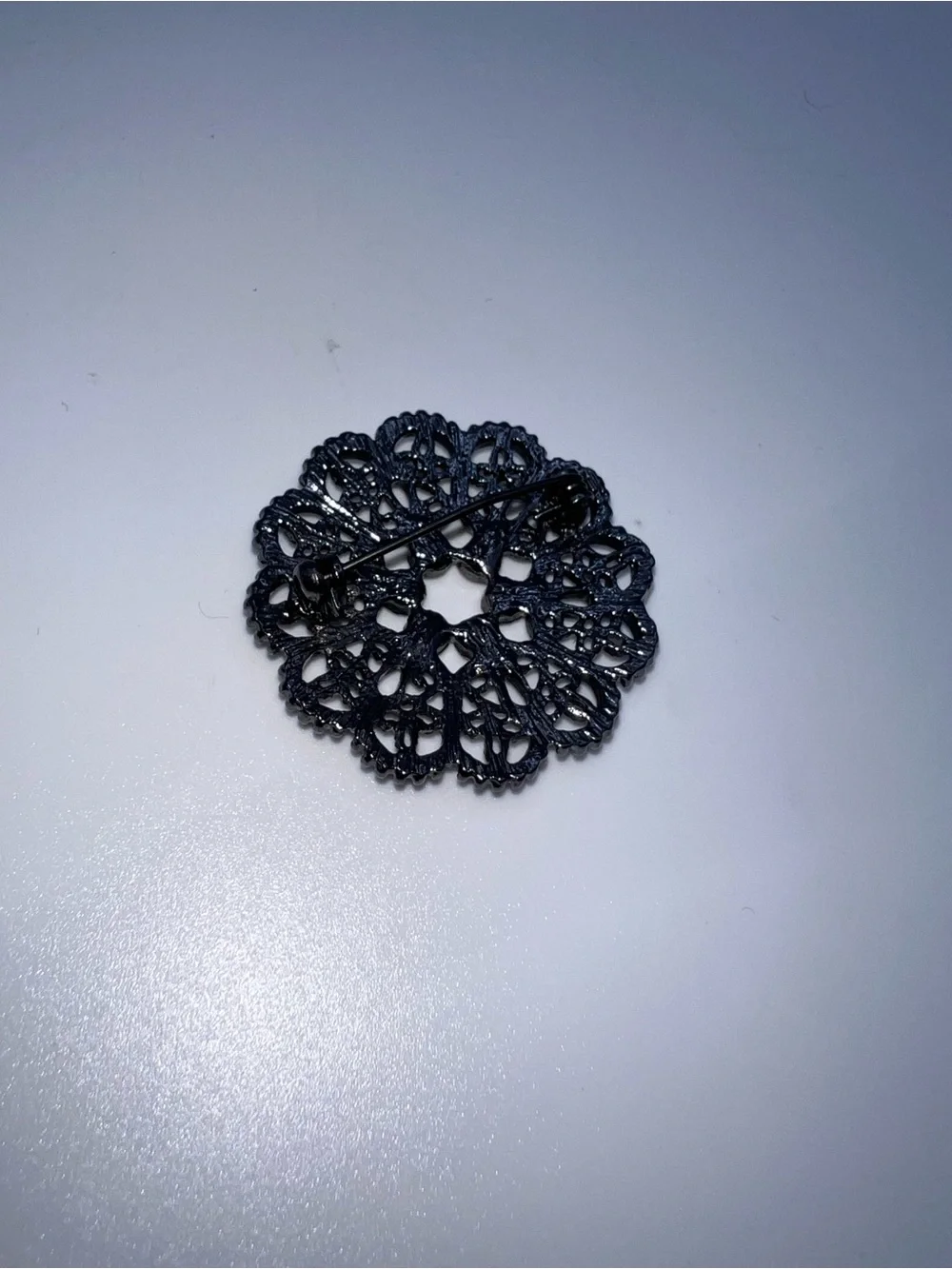 Black Filigree Round Brooch with Crystal Accents